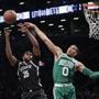 Boston Celtics' Jayson Tatum (0) blocks a shot by Brooklyn Nets' Trevor Booker (35) during the first half of an NBA basketball game Tuesday, Nov. 14, 2017, in New York. (AP Photo/Frank Franklin II)