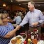 Democratic Senate nominee Doug Jones, right, shakes hands with Toni Vaughn, left, of Chelsea, Ala., as Jones campaigns at Niki's West restaurant, Wednesday, Sept. 27, 2017, in Birmingham, Ala. Jones will face former Alabama Chief Justice and U.S. Senate candidate Roy Moore. (AP Photo/Brynn Anderson)