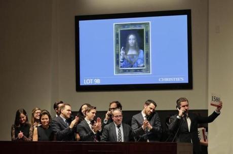 Bidding representatives react after Leonardo da Vinci's 