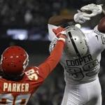 FILE - In this Oct. 19, 2017, file photo, Oakland Raiders wide receiver Amari Cooper, right, cannot catch a pass while defended by Kansas City Chiefs defensive back Ron Parker (38) during the first half of an NFL football game in Oakland, Calif. Who anticipated the NFL getting caught up in a back-and-forth with President Donald Trump over players kneeling during the national anthem? Or that the New York Giants and Oakland Raiders, playoff participants a year ago, would struggle so much? This NFL season has been full of surprises. (AP Photo/Marcio Jose Sanchez, File)