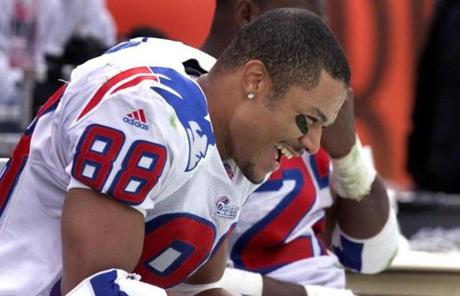 10-3-99:Cleveland, Ohio:Patriots' wide reciever Terry Glenn is all smiles on the bench following his fourth quarter touchdown that put away the Browns.

