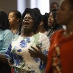 Congregants prayed during services at Boston?s First Christian Church Source of Grace, a church frequented by the Haitian community, last month.