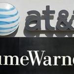 (FILES)This file combination of pictures shows an AT&T cellphone store (TOP) in Springfield, Virginia, on October 23, 2014, and the Time Warner company logo on the front of the headquarters building, 24 November, 2003 in New York. Shares of Time Warner tumbled on November 2, 2017 following a report the Justice Department could move to block the proposed $85 billion takeover of the company by AT&T. The Justice Department is considering a lawsuit to block the megadeal, but has not made a final decision, the Wall Street Journal reported. The two sides are in settlement talks with the department, but they are not close to an agreement, the report said. / AFP PHOTO / SAUL LOEB AND STAN HONDASAUL LOEB,