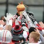 Boston MA 11/24/16 Catholic Memorial players reaching to touch the trophy after they defeated Boston College High during Thanksgiving Day football at Boston College High. (Photo by Matthew J. Lee/Globe staff) topic: 25bchigh reporter: