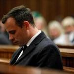 (FILES) This file photo taken on July 6, 2016 shows Paralympian athlete Oscar Pistorius (L), accused of the murder of his girlfriend Reeva Steenkamp three years ago, looking on during the hearing in his murder trail at the High Court in Pretoria. A South African appeals court increased paralympic champion Oscar Pistorius' sentence for murdering his girlfriend Reeva Steenkamp to 13 years and five months on November 24, 2017. / AFP PHOTO / POOL / MARCO LONGARIMARCO LONGARI/AFP/Getty Images