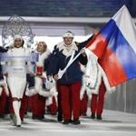Alexander Zubkov, who has now been stripped of his two gold medals, carried the national flag as he leads the team during the opening ceremony of the 2014 Winter Olympics in Sochi, Russia.