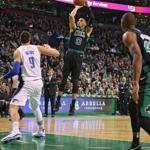 Boston MA 11/24/17 Boston Celtics Jayson Tatum pulls up for a jump shot over Orlando Magic Nikola Vecevic during first quarter NBA action at the TD Garden. (Matthew J. Lee/Globe staff) topic reporter: 