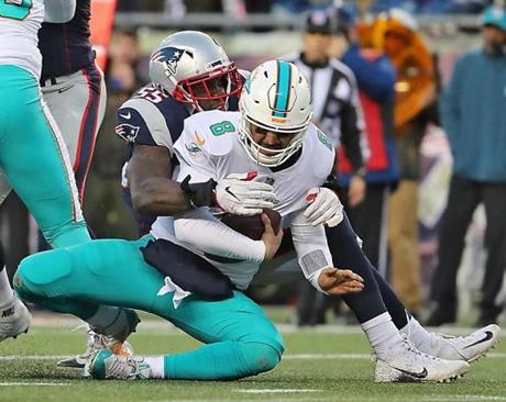 Foxborough MA 11/24/17 New England Patriots Eric Lee sacking Miami Dolphins Matt Moore for a 9-yard loss during fourth quarter action at Gillette Stadium. (Matthew J. Lee/Globe staff) topic reporter: 
