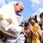 Pope Francis was welcomed by children Monday after arriving in Yangon, Myanmar.
