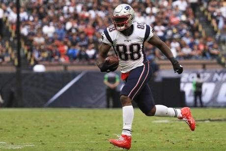 MEXICO CITY, MEXICO - NOVEMBER 19: Martellus Bennett #88 of the New England Patriots runs with the ball after a reception against the Oakland Raiders during the second half at Estadio Azteca on November 19, 2017 in Mexico City, Mexico. (Photo by Buda Mendes/Getty Images)
