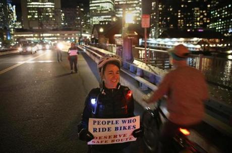 Jordan Hurley joined protesters in forming a people-protected bike lane on the Congress Street bridge in Boston on Friday.
