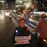 Jordan Hurley joined protesters in forming a people-protected bike lane on the Congress Street bridge in Boston on Friday.
