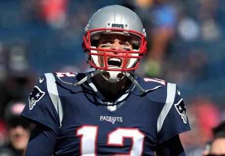 Foxborough, MA: October1, , 2017: Patriots quarterback Tom Brady does his usual pre game scream towards the fans in the south end zone as he comes out for pre game warmups. The New England Patriots hosted the Carolina Panthers in an NFL regular season football game at Gillette Stadium. (Jim Davis/Globe Staff). 
