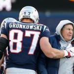 FOXBORO, MA - NOVEMBER 26: Rob Gronkowski #87 of the New England Patriots reacts with head coach Bill Belichick after catching a touchdown pass during the third quarter of a game against the Miami Dolphins at Gillette Stadium on November 26, 2017 in Foxboro, Massachusetts. (Photo by Jim Rogash/Getty Images)
