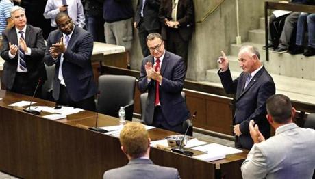 A farewell bid at Boston City Council Chambers by city councilor Bill Linehan on his last day. L-R City councilors Michael Flaherty, Tito Jackson, and Salvatore Lamattina with other members gave a round of applause.
