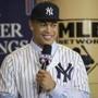 New Yankee Giancarlo Stanton answers questions during a press conference at the Major League Baseball winter meetings in Orlando, Fla., Monday, Dec. 11, 2017. (AP Photo/Willie J. Allen Jr.)