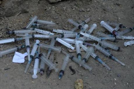 Used syringes and needles are seen under a bridge at the Kabul river where many addicts gather in Kabul on April 20, 2014. The NEJAT Centre is an Afghan response to vulnerable Afghan people, working with the communities for the prevention, treatment and care of drug users and HIV/Aids patients. Afghanistan produces around 90 percent of all opiate drugs in the world, but only recently became a major consumer - out of a population of 35 million, more than a million are now addicted to drugs. AFP PHOTO/SHAH MaraiSHAH MARAI/AFP/Getty Images
