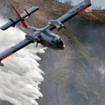 A Bombardier 415 Super Scooper dropped water on hot spots along the hillside east of Gibraltar Road in Santa Barbara, Calif., on Sunday morning.