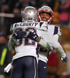 Pittsburgh, PA - 12/17/2017: Eric Rowe celebrates with Devin McCourty after Rowe tipped a pass in the end zone leading to interception securing Patriot's victory. The New England Patriots vs. the Pittsburgh Steelers at Heinz Field. Jim Davis / Globe staff
