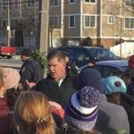 Angry parents confronted Mayor Martin J. Walsh at a Christmas tree lighting ceremony in West Roxbury on Sunday. The parents are angry over earlier start times planned for dozens of Boston?s schools.