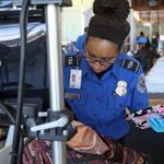 Officials from the Transportation Security Administration and Massport have introduced the new automated screening lanes at Logan Airport's terminal C.