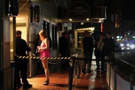 A doorman checked a woman identification outside the Royale and Candibar nightclubs on Tremont St. in the Theater District in Boston.
