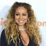 FILE - In this March 11, 2017 file photo, Mariah Carey arrives at the Kids' Choice Awards in Los Angeles. Carey was nominated for a Golden Globe for best original song on Monday, Dec. 11, 2017, for 