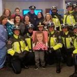 Patrick Murphy joined officers of the Arlington Police Department to deliver more than 900 donated toys Thursday and was named an honorary police chief for the day.