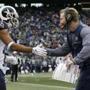 Los Angeles Rams head coach Sean McVay, right, greets wide receiver Robert Woods, left, after Rams' Todd Gurley scored a touchdown in the first half of an NFL football game, Sunday, Dec. 17, 2017, in Seattle. (AP Photo/John Froschauer)