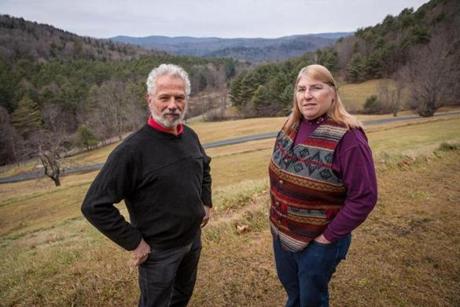 Tunbridge residents Michael Sacca (L) and Jane Huppee are pictured at Huppee's home in Tunbridge, VT on Sunday, December 03, 2017. They're surrounded by land that the wealthy Mormon developer David Hall wants to build a sustainable, high-tech, high-density community on and they are opposed to. (Matthew Cavanaugh for The Boston Globe)
