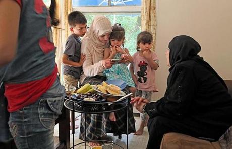 SYRIAN SLIDER Framingham, Ma., 07/16/17, The Hayani family welcomes the newest and last family of Syrian refugees. Suzanne Kreiter/Globe staff
