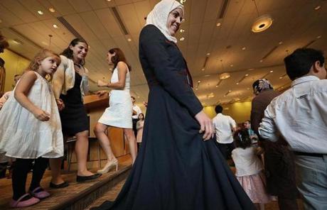 SYRIAN SLIDER Wellesley, MA., 09/30/17, The Syrian families are part of the Yom Kippur celebration at Temple Beth Elohim. Suzanne Kreiter/Globe staff
