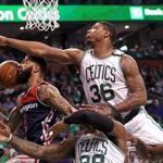 Boston, MA - 5/15/2017 - (3rd quarter) Boston Celtics guard Marcus Smart (36) and the Celtics defense put the clamps on Washington Wizards forward Markieff Morris (5)on this play during the third quarter. The Boston Celtics host the Washington Wizards in Game 7 of the Eastern Conference Semi-Finals at TD Garden. - (Barry Chin/Globe Staff), Section: Sports, Reporter: Adam Himmelsbach, Topic: 16Celtics-Wizards, LOID: 8.3.2508922496.