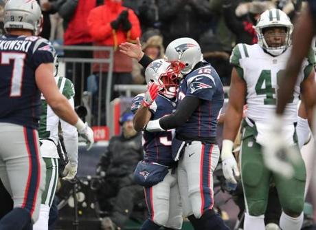 Foxborough MA 12/31/17 New England Patriots Tom Brady celebrates his 5 yardetouchdown reception with teammate Dion Lewis against the New York Jets during second quarter action at Gillette Stadium. (Matthew J. Lee/Globe staff) topic reporter: 
