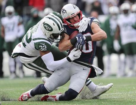 Jets cornerback Juston Burris took down Patriots wide receiver Danny Amendola in the first quarter.
