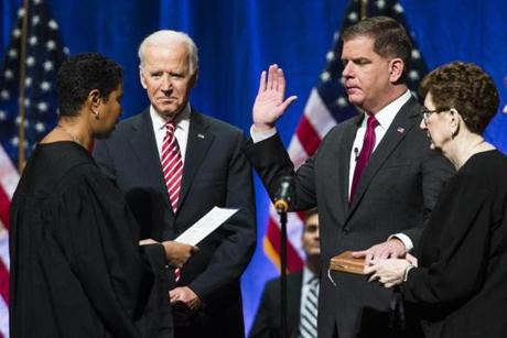 Former US Vice President Joe Biden watched as Boston Mayor Martin J. Walsh was sworn in during his second inauguration on Monday.
