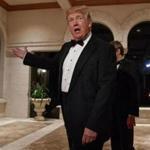 President Donald Trump spoke with reporters Sunday at a New Year's Eve gala at his Mar-a-Lago resort, in Palm Beach, Fla. 