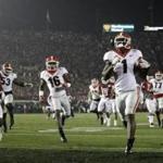 Georgia running back Sony Michel (1) scores a touchdown in overtime against Oklahoma in the Rose Bowl NCAA college football game, Monday, Jan. 1, 2018, in Pasadena, Calif. Georgia won 54-48. (AP Photo/Jae C. Hong)