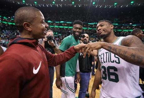 Boston, MA 1-3-18: The Cavaliers Isaiah Thomas (left) is pictured as he shares a moment with former Celtics teammates Jaylen Brown (center) and Marcus Smart (right) on the court following the game. The Cleveland Cavaliers visited the Boston Celtics in a regular season NBA basketball game at TD Garden. (Jim Davis/Globe Staff)
