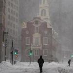 Boston, Massachusetts - 1/4/2018 - Passersby walk through the snow near the Old State House in Boston, Massachusetts, January 4, 2018. (Keith Bedford/Globe Staff) 