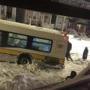Residents in East Boston helped to push a MBTA bus that got stuck in the snow. 