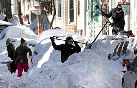 STORM SLIDER BOSTON, MA - 1/05/2018: Shovel Out...Three families of kids help out to shovel cars on E Sixth Street in South Boston. (David L Ryan/Globe Staff ) SECTION: METRO TOPIC 06bostonsnowpic
