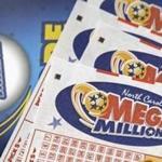 Mega Millions lottery tickets rest on a counter at a Pilot travel center near Burlington, N.C.