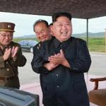 Kim Jong-un (right) celebrated what was said to be a missile test launch in North Korea.