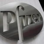 (FILES) This file photo taken on April 26, 2016 shows the Pfizer company logo in front of Pfizers headquarters in New York. US pharmaceutical giant Pfizer reported on October 31, 2017 that third-quarter profit more than doubled as strength in newer drugs to treat cancer and other illnesses offset the hit from patent expirations. Net income came in at $2.8 billion, compared with just under $1.4 billion in the year-ago period, a quarter that was hit with one-time expenses connected to Pfizer acquisitions. / AFP PHOTO / DON EMMERTDON EMMERT/AFP/Getty Images