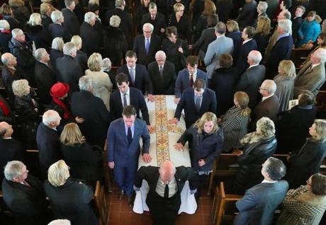 A funeral Mass was held at St. Paul Church in Wellesley for Robert Q. Crane, the former state treasurer. His six grandchildren were the pallbearers.
