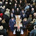 A funeral Mass was held at St. Paul Church in Wellesley for Robert Q. Crane, the former state treasurer. His six grandchildren were the pallbearers.