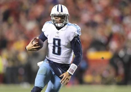 Tennessee Titans quarterback Marcus Mariota (8) runs against the Kansas City Chiefs during the second half of an NFL wild-card playoff game in Kansas City, Mo., Saturday, Jan. 6, 2018. (AP Photo/Reed Hoffmann)
