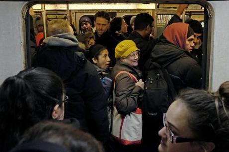 BOSTON Ñ 2/19/2015: People cram into an Orange Line train on Thursday. Commuters faced long lines and crowded trains again, often leaving people to wait ten or more minutes for the next train to arrive. (Sean Proctor/Globe Staff)

