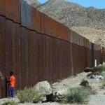 A child stood on the US side of the border wall that divides Ciudad Juarez, Mexico, from Sunland Park, N.M. 